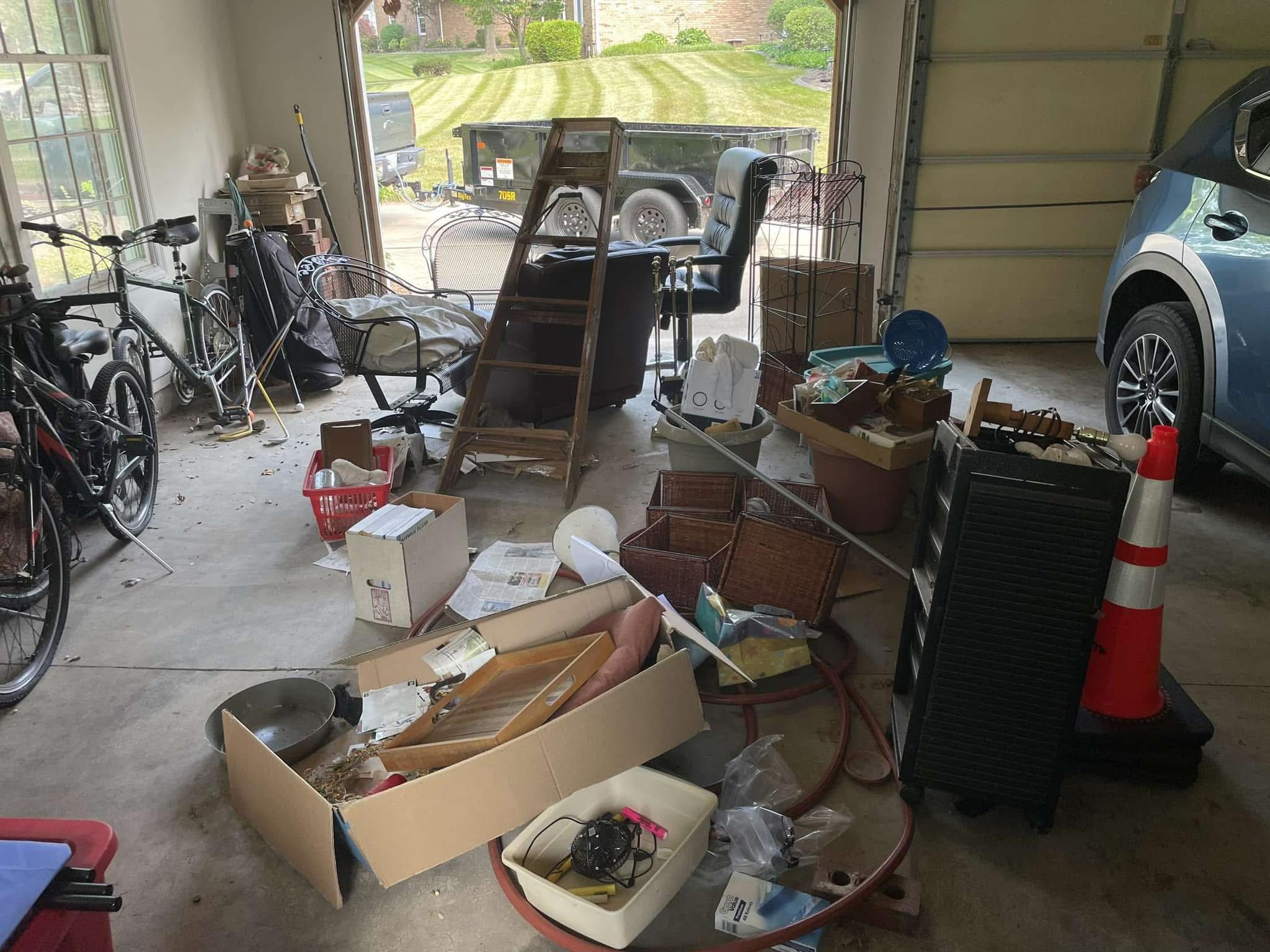 Garage before clean-out, packed with boxes and clutter