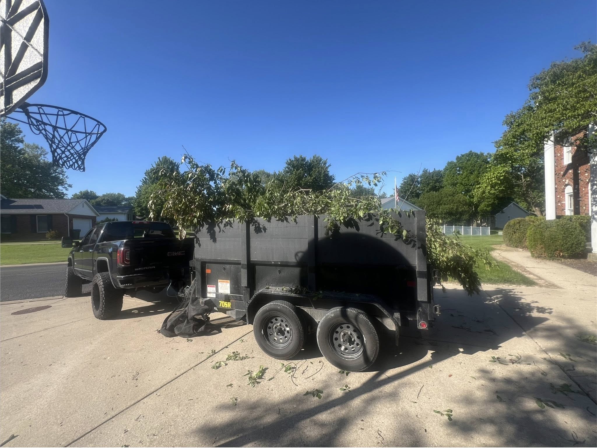 Truck and trailer loaded with brush