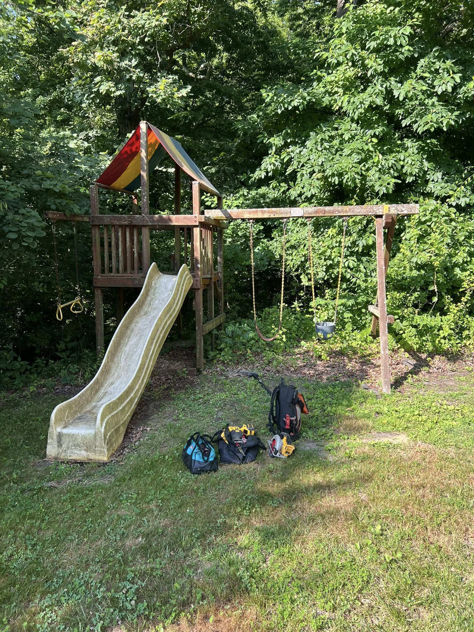 Old swing set being prepped for removal
